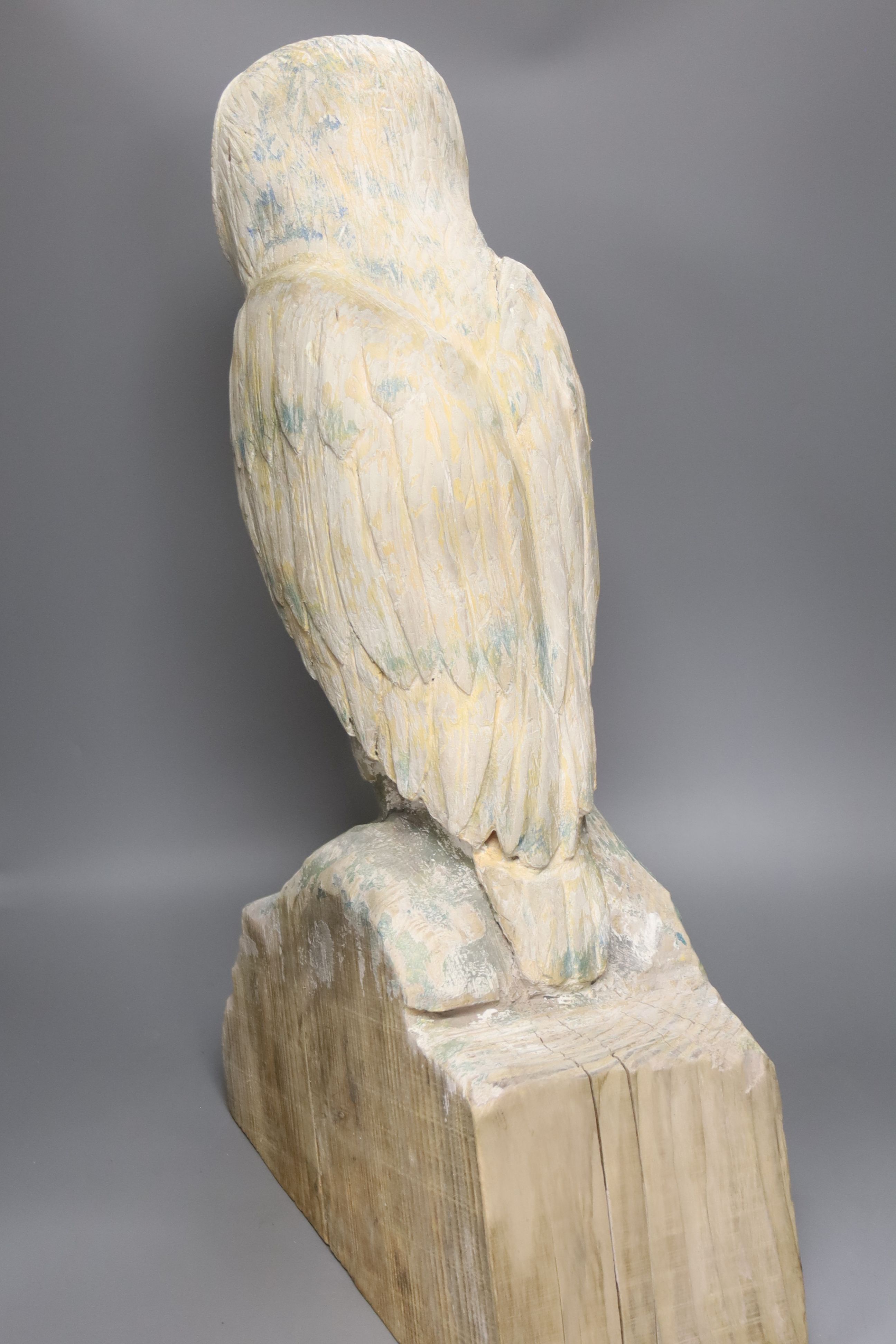 A carved wood owl, 63cm high